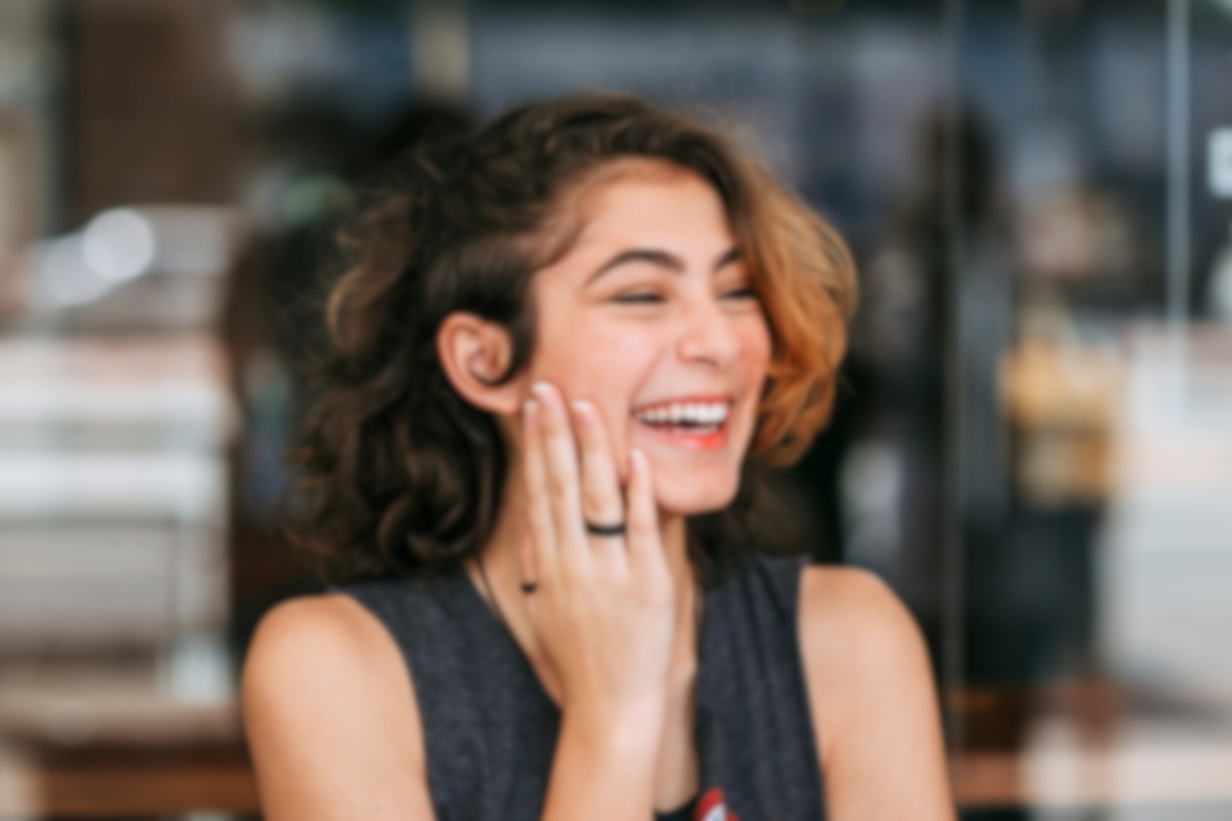 Shallow Focus Photo of a Beautiful Woman Laughing