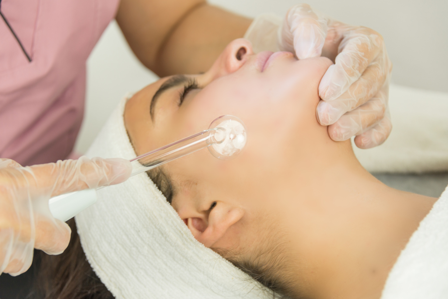 Cosmetologist Preparing Client for Treatment